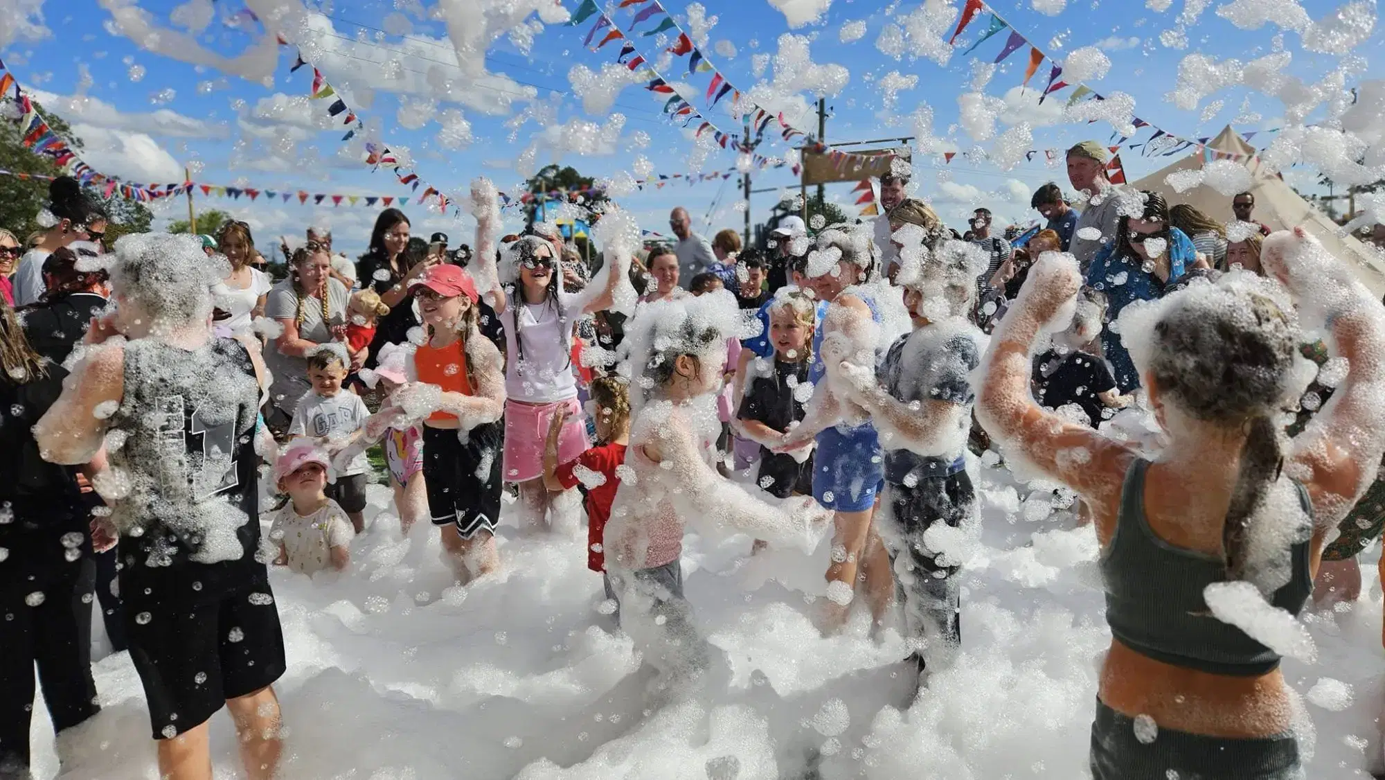 Children playing in a foam party at Monk Park Farm
